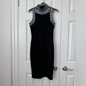 Black mid length, fitted evening dress, with beaded neckline